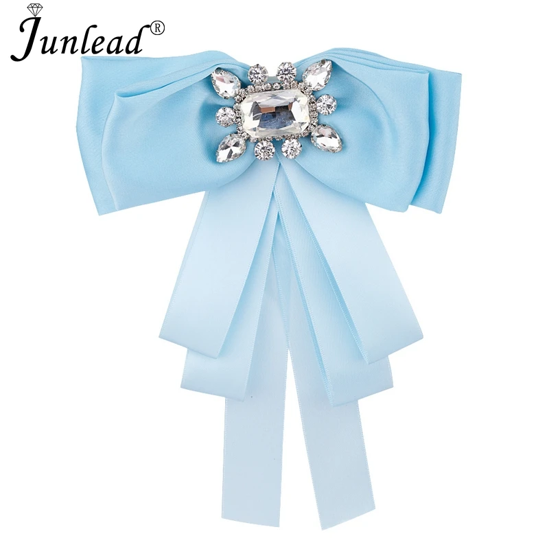 Junlead Latest design Brooches Wedding White Ribbon Fabric brooch with big Crystal Bow Brooch pin for women shirt clothing Dress
Junlead Latest design Brooches Wedding White Ribbon Fabric brooch with big Crystal Bow Brooch pin for women shirt clothing Dress