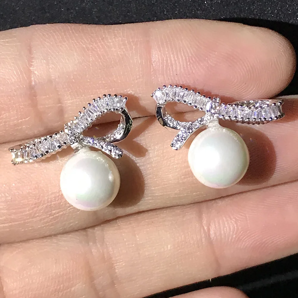 Exquisite Bow Simulated Pearl Earrings 925 Silver For Women Fine Quality New Korean Fashion Jewelry Gift
Exquisite Bow Simulated Pearl Earrings 925 Silver For Women Fine Quality New Korean Fashion Jewelry Gift