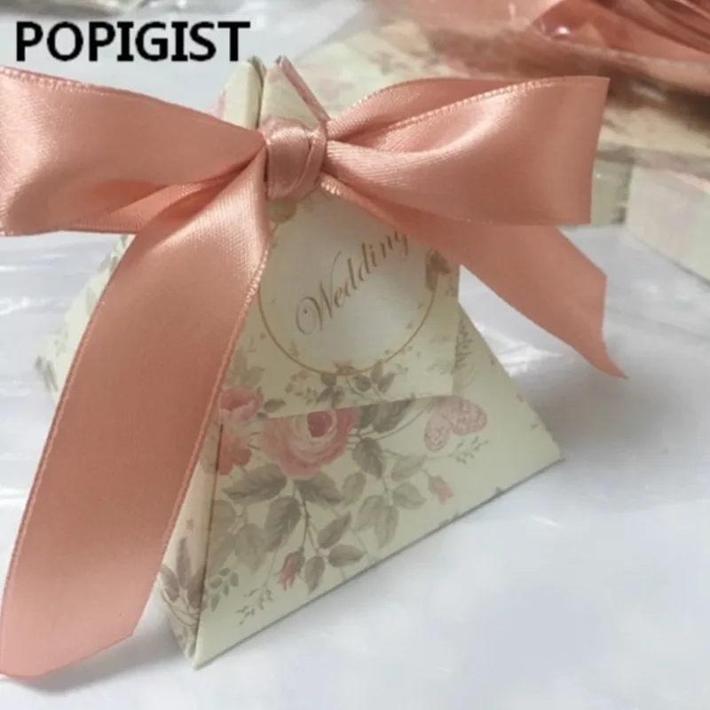 Creative Floral Printed Triangular Pyramid Wedding Favors Candy Boxes Bridal Shower Party Gift Box With Ribbons & Tags 50pcs
Creative Floral Printed Triangular Pyramid Wedding Favors Candy Boxes Bridal Shower Party Gift Box With Ribbons & Tags 50pcs