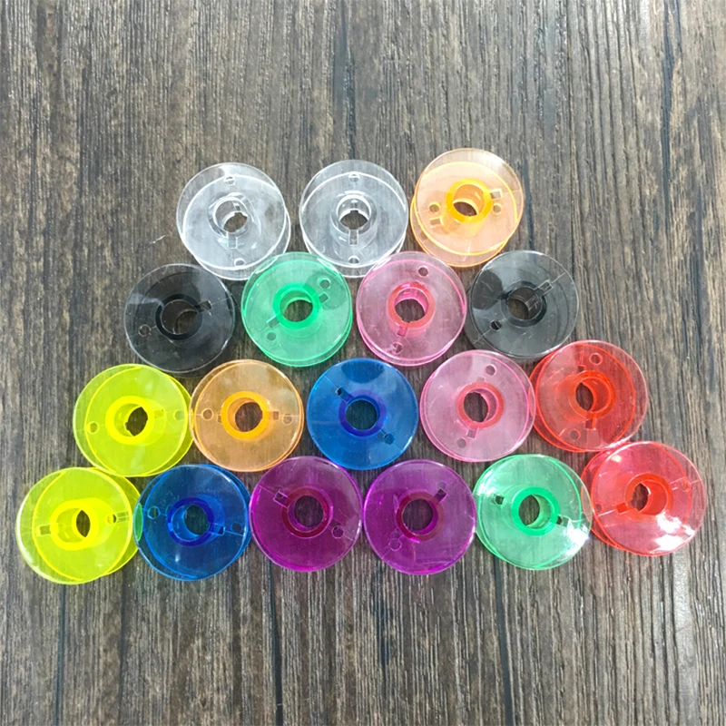 Hot 1PC High Quality Transparent Sewing Machine Bobbins Plastic Shuttle Cords Tailoring Accessories Home Color Bobbin Lock Core
Hot 1PC High Quality Transparent Sewing Machine Bobbins Plastic Shuttle Cords Tailoring Accessories Home Color Bobbin Lock Core