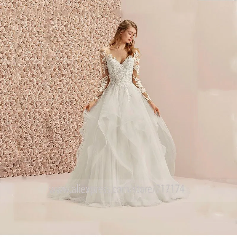 V-neck Neckline Long Tulle Button Sleeves Lace Applique Wedding Dress with Layer Illusion Back Sweep Train A-line Bridal Dress
V-neck Neckline Long Tulle Button Sleeves Lace Applique Wedding Dress with Layer Illusion Back Sweep Train A-line Bridal Dress
