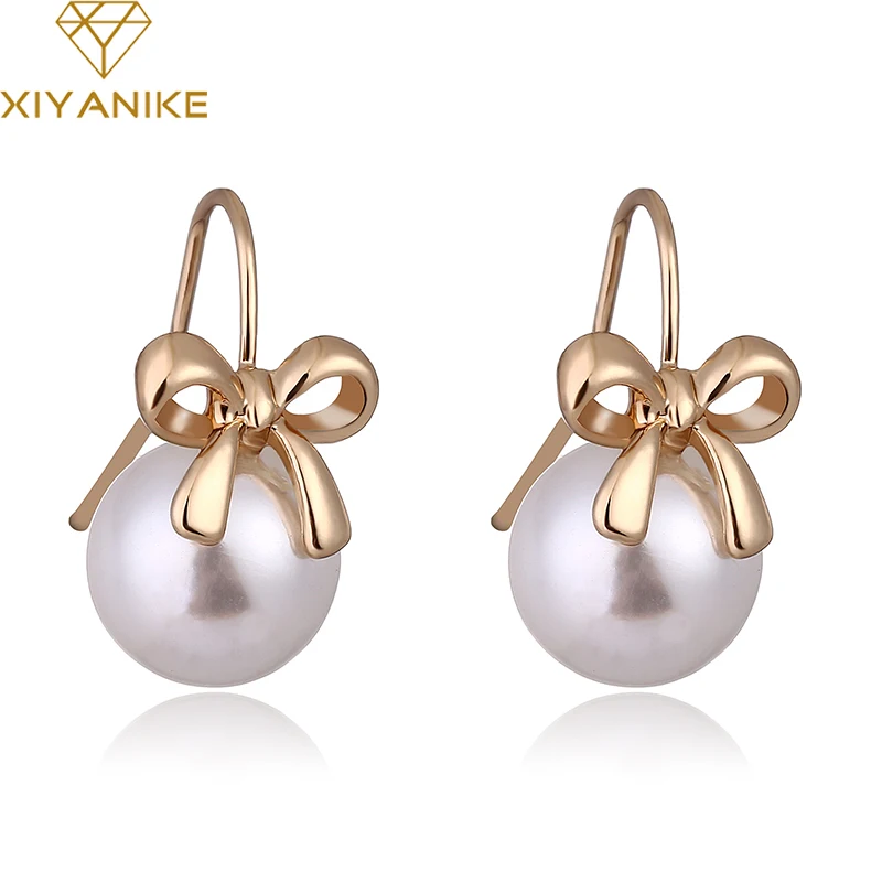 New Luxury Brand Design Trendy Imitated Pearl Earrings Women Lovely Cute Bow Pearl Stud Earrings Ladies Jewelry Female XY-E381
New Luxury Brand Design Trendy Imitated Pearl Earrings Women Lovely Cute Bow Pearl Stud Earrings Ladies Jewelry Female XY-E381
