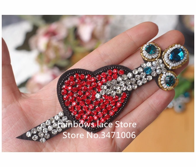 3D clothing nail pearl patches materials red love arrow exquisite nail bead cloth paste high quality nail bead flower applique
3D clothing nail pearl patches materials red love arrow exquisite nail bead cloth paste high quality nail bead flower applique