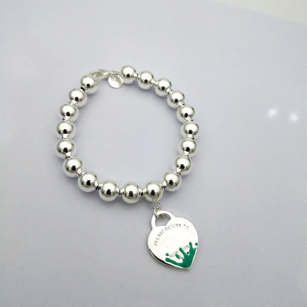 TIFF100%925 sterling silver classic heart-shaped logo blue spray enamel round bead bracelet lady fashion jewelry gift of love
TIFF100%925 sterling silver classic heart-shaped logo blue spray enamel round bead bracelet lady fashion jewelry gift of love
