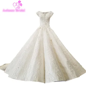 AOLANES 2018 Champagne Lace Sleeveless V-neck Vintage Wedding Dresses Long Train Waves Ball Gown Princess Illusion Bridal Gowns
AOLANES 2018 Champagne Lace Sleeveless V-neck Vintage Wedding Dresses Long Train Waves Ball Gown Princess Illusion Bridal Gowns