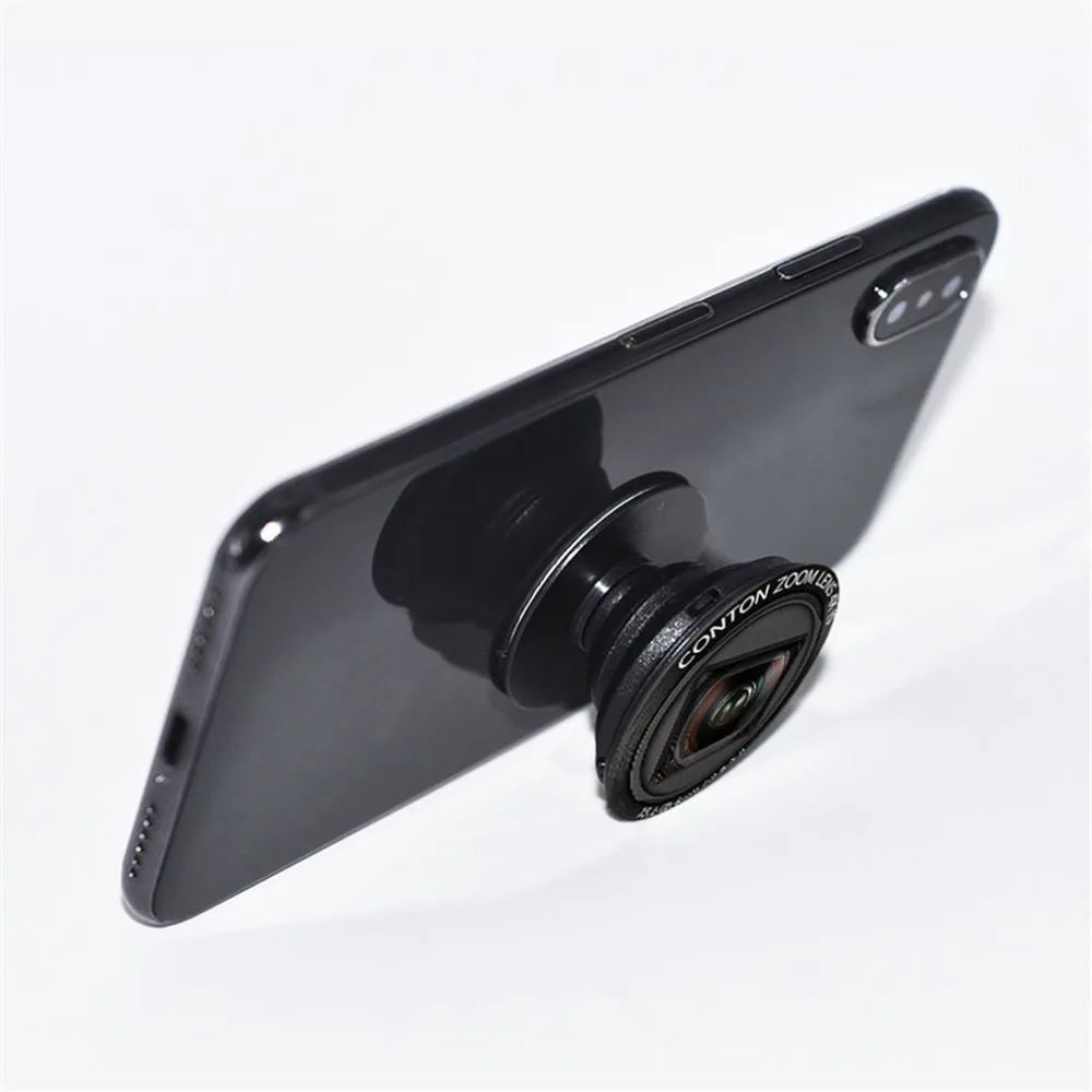 Mobile Phone Holder Camera Lens Design Fashion Gasbag Telephone Bracket Stand Cellphone Part Man Woman Fashion Accessories
Mobile Phone Holder Camera Lens Design Fashion Gasbag Telephone Bracket Stand Cellphone Part Man Woman Fashion Accessories