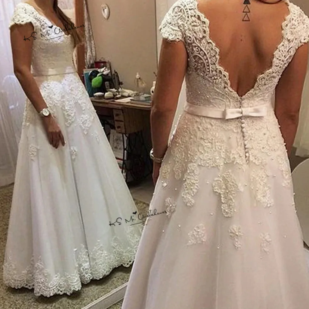 Vestido de Noiva A Line White Wedding Dresses 2019 Pearls Lace Wedding Gowns Cheap Bride Dress Cap Sleeve V Neck Back Mariage
Vestido de Noiva A Line White Wedding Dresses 2019 Pearls Lace Wedding Gowns Cheap Bride Dress Cap Sleeve V Neck Back Mariage