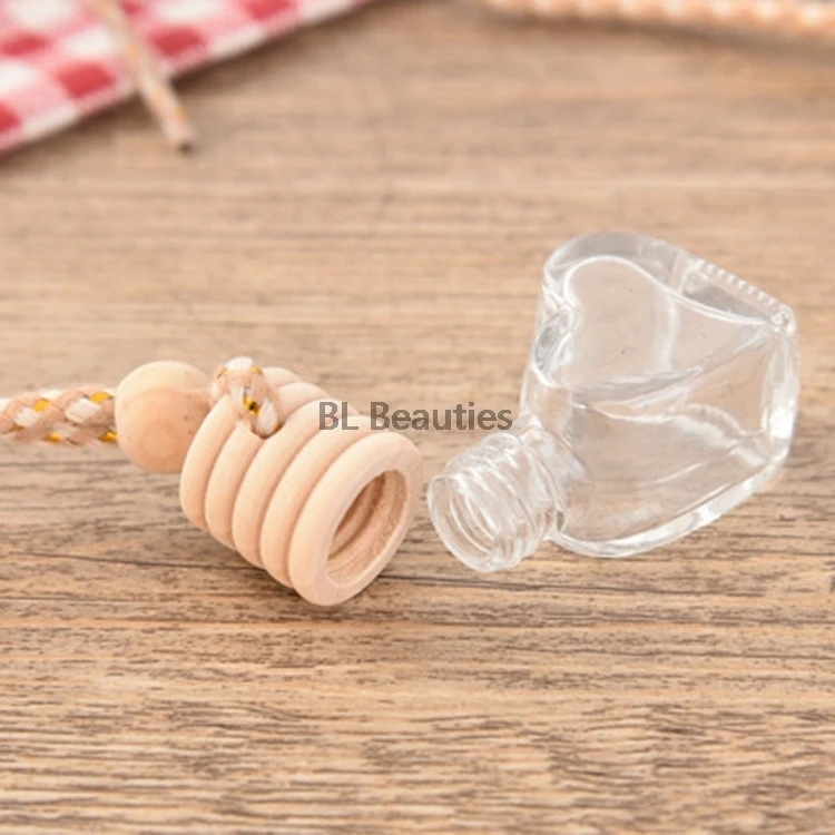 100pcs/lot Empty Perfume Hanging Bottle Heart Shape Glass Car Pendant Automobile Styling Decoration Automotive Perfume Bottle
100pcs/lot Empty Perfume Hanging Bottle Heart Shape Glass Car Pendant Automobile Styling Decoration Automotive Perfume Bottle