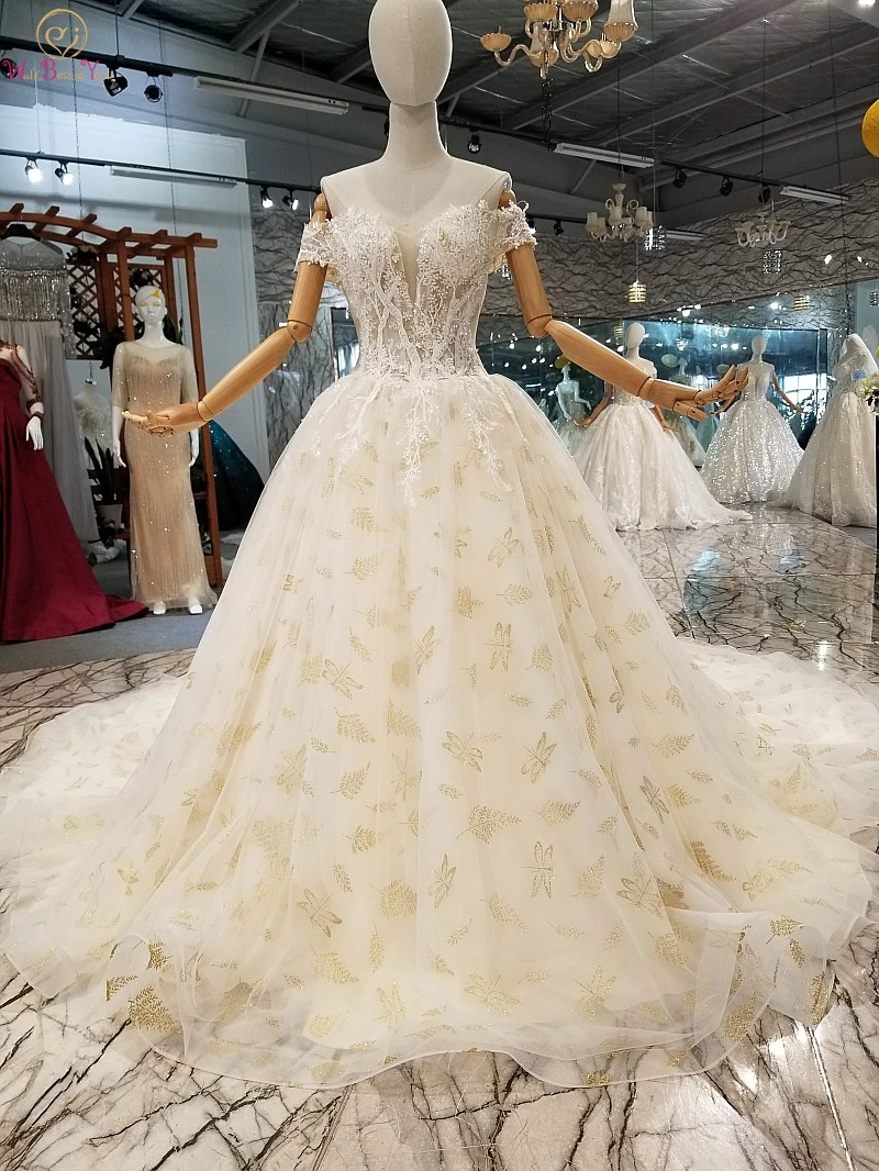 Luxury Wedding Dresses Embroidery Tulle Lace Applique Champagne Beaded Transparent Off Shoulder Ball Gown Court Train Bride Gown
Luxury Wedding Dresses Embroidery Tulle Lace Applique Champagne Beaded Transparent Off Shoulder Ball Gown Court Train Bride Gown