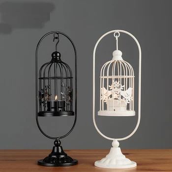 Creative home wrought iron candlestick decorations European retro hanging wind lamp birdcage candlestick display Candlelight din
Creative home wrought iron candlestick decorations European retro hanging wind lamp birdcage candlestick display Candlelight din
