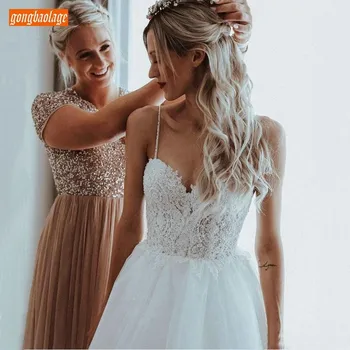 Elegant Lace Beaded Top Boho Wedding Dress Spaghetti Strap A Line Bridal Dresses Sexy Backless Sleeveless Beach Wedding Gowns
Elegant Lace Beaded Top Boho Wedding Dress Spaghetti Strap A Line Bridal Dresses Sexy Backless Sleeveless Beach Wedding Gowns