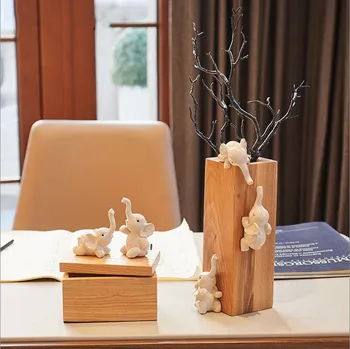 A pair of simple modern elephant ornaments vase multi-function storage box wooden jewelry storage box gift home decorations
A pair of simple modern elephant ornaments vase multi-function storage box wooden jewelry storage box gift home decorations
