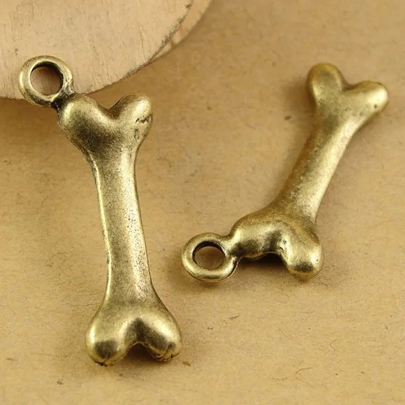 Фото 50pcs 28*9MM Antique Bronze dog bone charm pendant parts manual DIY retro jewelry wholesale pet collar charms tibetan | Украшения и