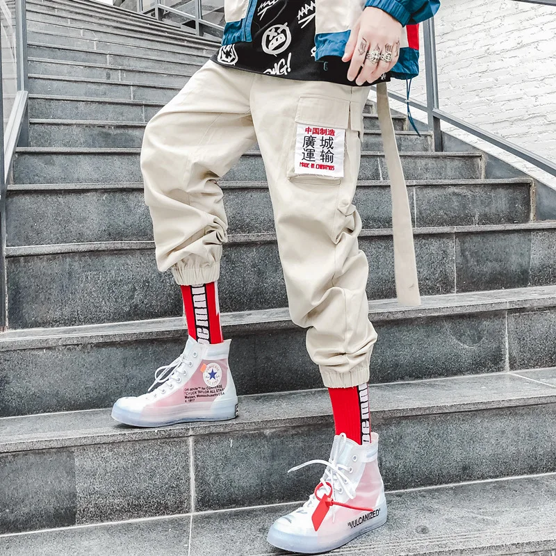 US Size Cargo Pants Men Ribbon Ankle-length Pants Letter Embroidery Hip Hop Harem Male Joggers Streetwear Skateboard GY21
US Size Cargo Pants Men Ribbon Ankle-length Pants Letter Embroidery Hip Hop Harem Male Joggers Streetwear Skateboard GY21