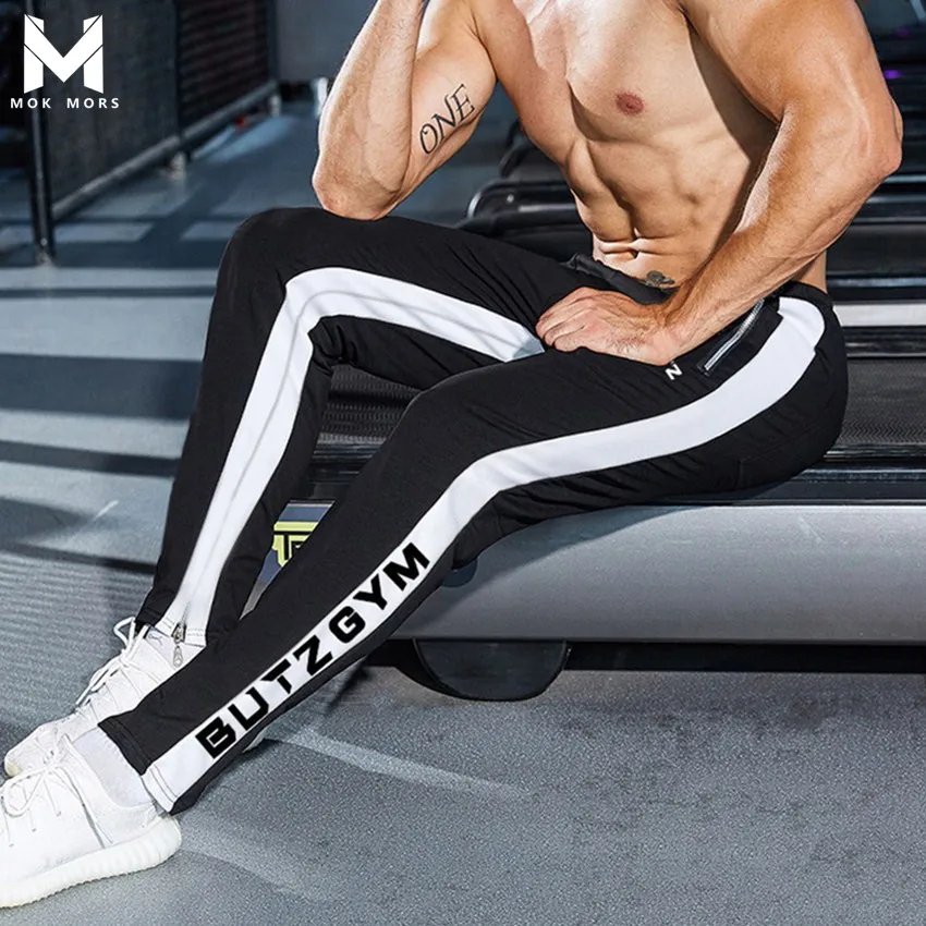 Men's New Wild Low Waist Stitching BUTZ Letter Printing Trousers Men Fashion Brand Elastic Band Cotton Mens Pants
Men's New Wild Low Waist Stitching BUTZ Letter Printing Trousers Men Fashion Brand Elastic Band Cotton Mens Pants