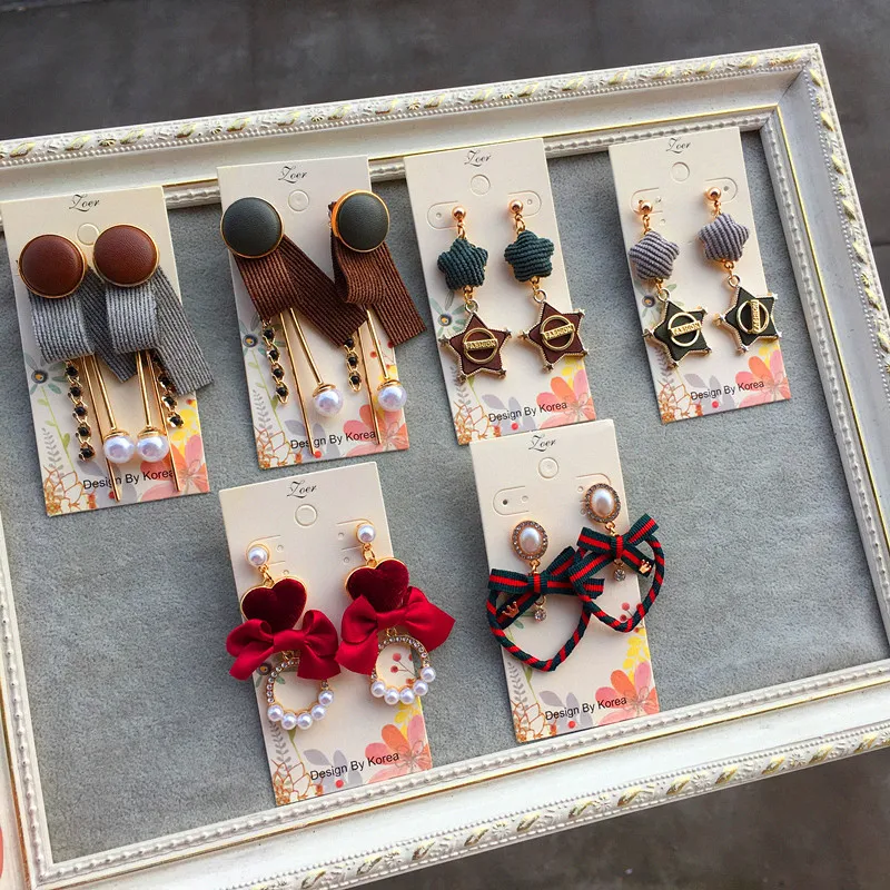 Korean anti allergy hand woven ribbon bowknot Heart S925 Silver earpins Sweet temperament womens pendants earrings wholesale 425
Korean anti allergy hand woven ribbon bowknot Heart S925 Silver earpins Sweet temperament womens pendants earrings wholesale 425