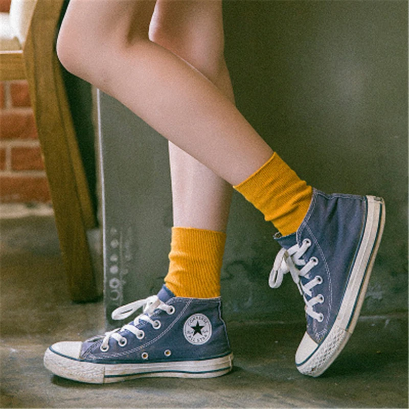 Girl shows sweaty stinky converse sneaker