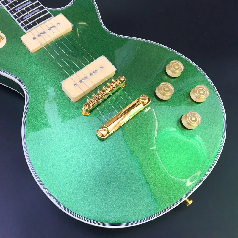 Factory customized electric guitar, metal green electric guitar, rose wood fingerboard, square inlay, P90 pickup, color can be c
Factory customized electric guitar, metal green electric guitar, rose wood fingerboard, square inlay, P90 pickup, color can be c