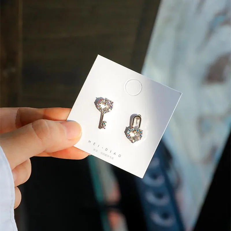 Korean personality simple and asymmetrical mini key lock heart earrings for Women Korean Minimalist Earrings Jewelry Wholesale
Korean personality simple and asymmetrical mini key lock heart earrings for Women Korean Minimalist Earrings Jewelry Wholesale