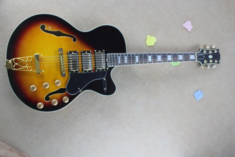 Top Quality G L5 L-5 MOdel guitar, Hollow Body Archtop Guitar, Flamed Maple Sunset color Electric Guitar Spring vibrato
Top Quality G L5 L-5 MOdel guitar, Hollow Body Archtop Guitar, Flamed Maple Sunset color Electric Guitar Spring vibrato