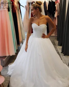 Elegant Sweetheart A-Line Wedding Dresses Pearls Beading Tulle Bridal Gowns With Sweep Train Plus Size abito sposa 2019
Elegant Sweetheart A-Line Wedding Dresses Pearls Beading Tulle Bridal Gowns With Sweep Train Plus Size abito sposa 2019