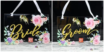 Colorful Flower Style Clear Acrylic Gold Bride & Groom Wedding Chair Sign Hanging Signs for Garden Wedding Decoration
Colorful Flower Style Clear Acrylic Gold Bride & Groom Wedding Chair Sign Hanging Signs for Garden Wedding Decoration