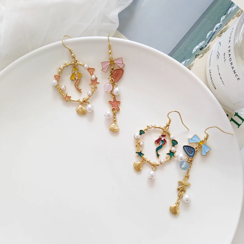 Korean Sweet Girl Imitation Pearl Bowknot Asymmetric Dangle Earrings Female Personality Mermaid Star Shell Pendant Ear Clip
Korean Sweet Girl Imitation Pearl Bowknot Asymmetric Dangle Earrings Female Personality Mermaid Star Shell Pendant Ear Clip