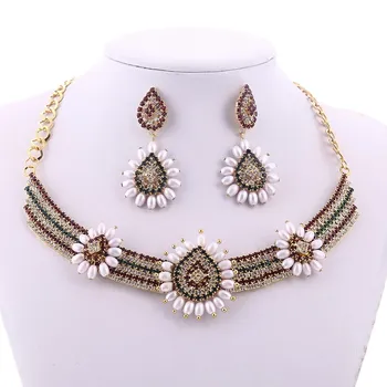 MINHIN New Style Bohemia Flower Pearl Choker Necklace Dangle Earring Set Delicate Crystal Jewelry Set Women Statement Accessory
MINHIN New Style Bohemia Flower Pearl Choker Necklace Dangle Earring Set Delicate Crystal Jewelry Set Women Statement Accessory