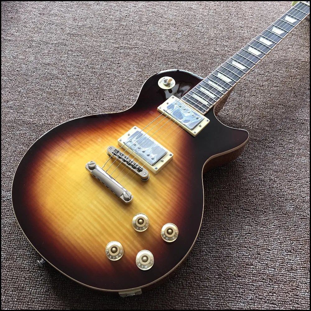 Vicers one piece body and neck in sunburst color yellow inlays , Upgrade Tune-o-Matic bridge with cream frets end binding guitar
Vicers one piece body and neck in sunburst color yellow inlays , Upgrade Tune-o-Matic bridge with cream frets end binding guitar