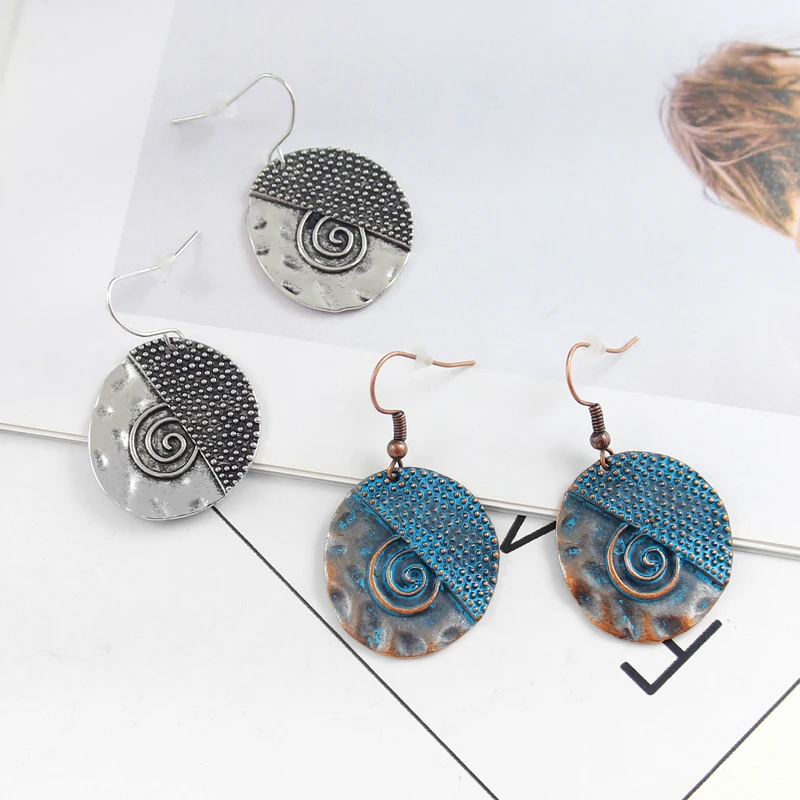 Round spiral wave embellished small dots irregular two-color pendant earrings national style nostalgic retro charm earrings
Round spiral wave embellished small dots irregular two-color pendant earrings national style nostalgic retro charm earrings