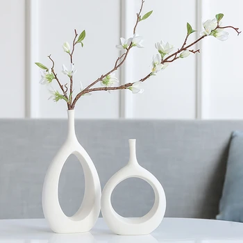Nordic simple ceramic stem flower vases Hollow vase Floral ornaments Home living room countertop decoration flower insert
Nordic simple ceramic stem flower vases Hollow vase Floral ornaments Home living room countertop decoration flower insert
