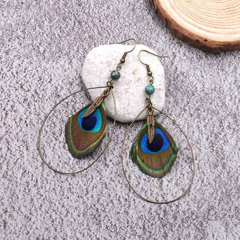 Women Boho Natural Peacock Feathers Pendant Earrings Jewelry Bohemian Big Water Drop Metal Round Circle Leaf Beads Earring
Women Boho Natural Peacock Feathers Pendant Earrings Jewelry Bohemian Big Water Drop Metal Round Circle Leaf Beads Earring