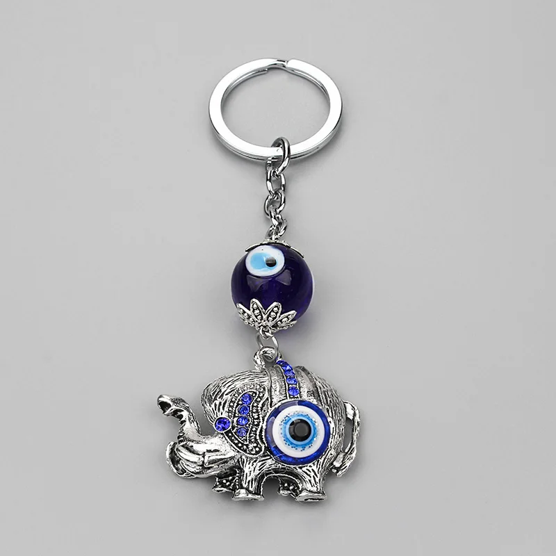 New Coming Alloy Metal Antique Silver Elephant Pendant Glass Evil Eye Bead Protection Religion Keyring Vintage Keychain
New Coming Alloy Metal Antique Silver Elephant Pendant Glass Evil Eye Bead Protection Religion Keyring Vintage Keychain