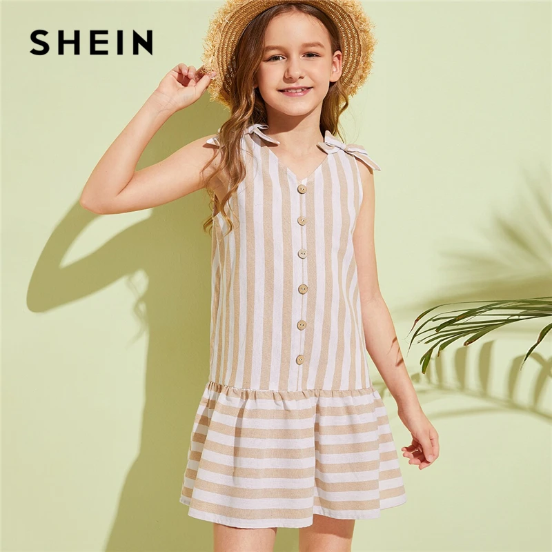 

SHEIN Kiddie V Neck Khaki Striped Knot Shoulder Girls Boho Dress 2019 Summer Sleeveless Drop Waist Ruffle Hem Cute Tunic Dresses