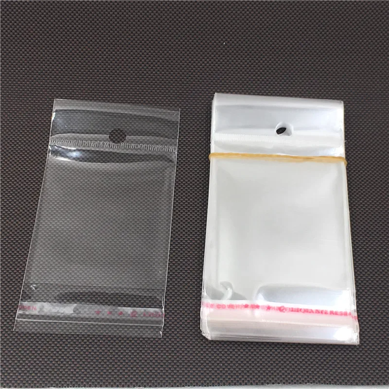 100 pcs Transparent Waterproof Self-Adhesive Seal Plastic Packaging OPP Bags With Hanging Hole Clear Gift Bags
100 pcs Transparent Waterproof Self-Adhesive Seal Plastic Packaging OPP Bags With Hanging Hole Clear Gift Bags