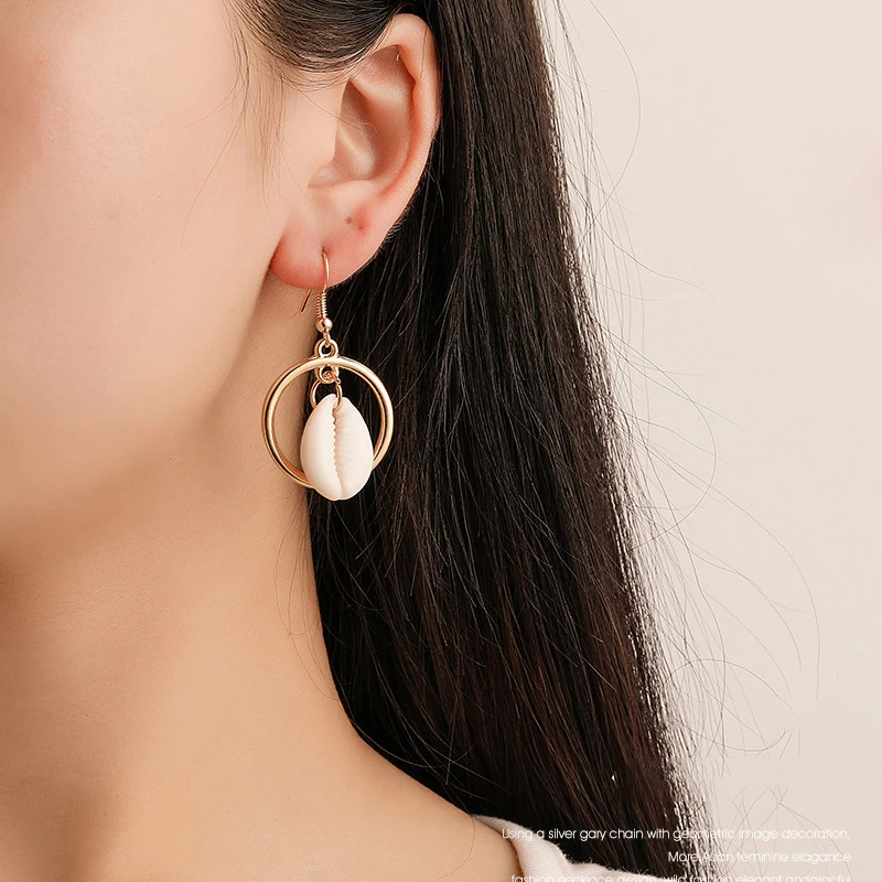 Female Asymmetrical Shell Conch Drop Earrings Golden Imitation Pearl Dangle Earrings Bohemian Ear Earings Jewelry For Women
Female Asymmetrical Shell Conch Drop Earrings Golden Imitation Pearl Dangle Earrings Bohemian Ear Earings Jewelry For Women