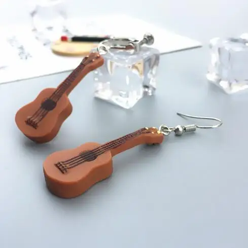 Personalized punk small guitar earrings for Women Men Musical Lover Jewelry Cool Guitar Dangle Earrings Acrylic Funny gifts
Personalized punk small guitar earrings for Women Men Musical Lover Jewelry Cool Guitar Dangle Earrings Acrylic Funny gifts