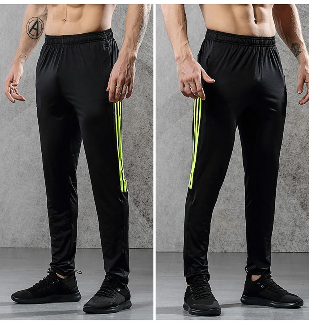 Image from the front men's breathable elastics pants for sport. Sport's breathable leggings for sport black with yellow line color. Foto from the front men's breathable elastics pants for sport. Sport's breathable leggings for sport black with yellow line color.