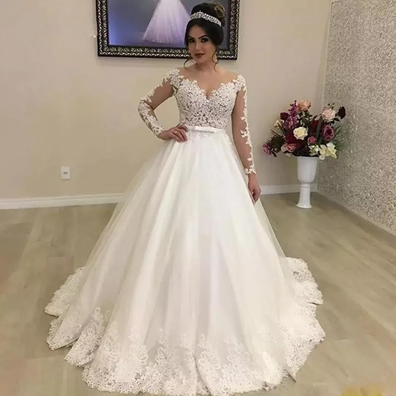 White/Ivory Ball Gown Garden Wedding Dresses Bridal Gowns Jewel Neck Illusion Long Sleeve Bow Tie Belt Wedding Gown
White/Ivory Ball Gown Garden Wedding Dresses Bridal Gowns Jewel Neck Illusion Long Sleeve Bow Tie Belt Wedding Gown