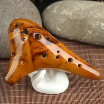 Twelve Kong Tao flute alto C smoldered ocarina AC / 12 hole specialized teaching flute to send materials wholesale
Twelve Kong Tao flute alto C smoldered ocarina AC / 12 hole specialized teaching flute to send materials wholesale