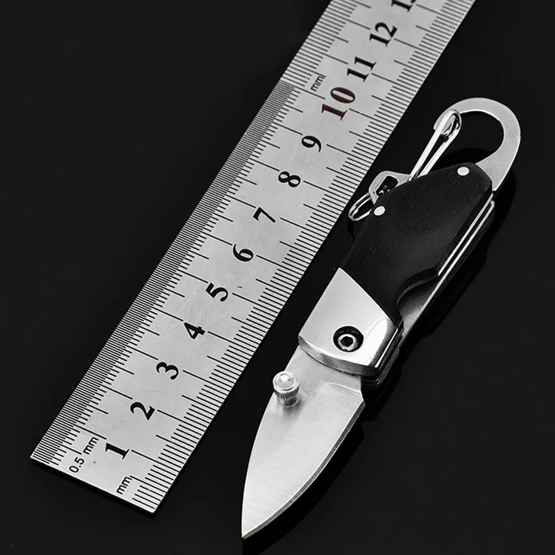 New Stainless Steel Mini Folding Knife With Carabiner Hanging Buckle Hike Outdoor Camp Survive Kit Portable Pocket Tool
New Stainless Steel Mini Folding Knife With Carabiner Hanging Buckle Hike Outdoor Camp Survive Kit Portable Pocket Tool