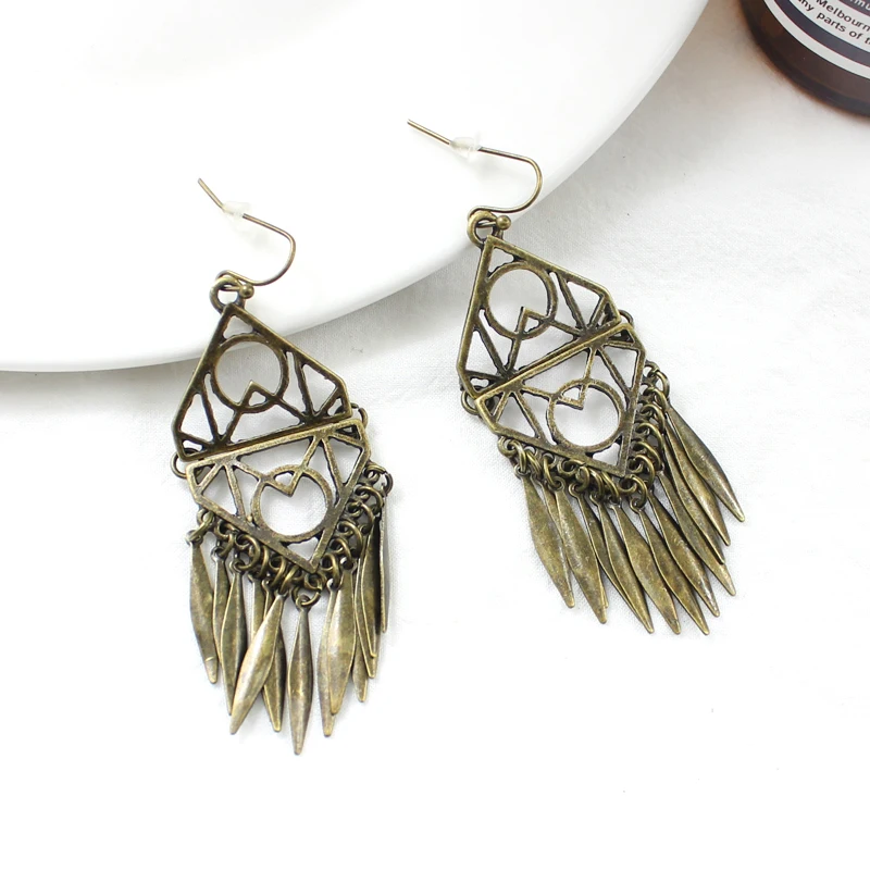 geometric splice Hollow Symmetrical pattern metal tassel pendant earrings Vintage gold personality earrings National style
geometric splice Hollow Symmetrical pattern metal tassel pendant earrings Vintage gold personality earrings National style