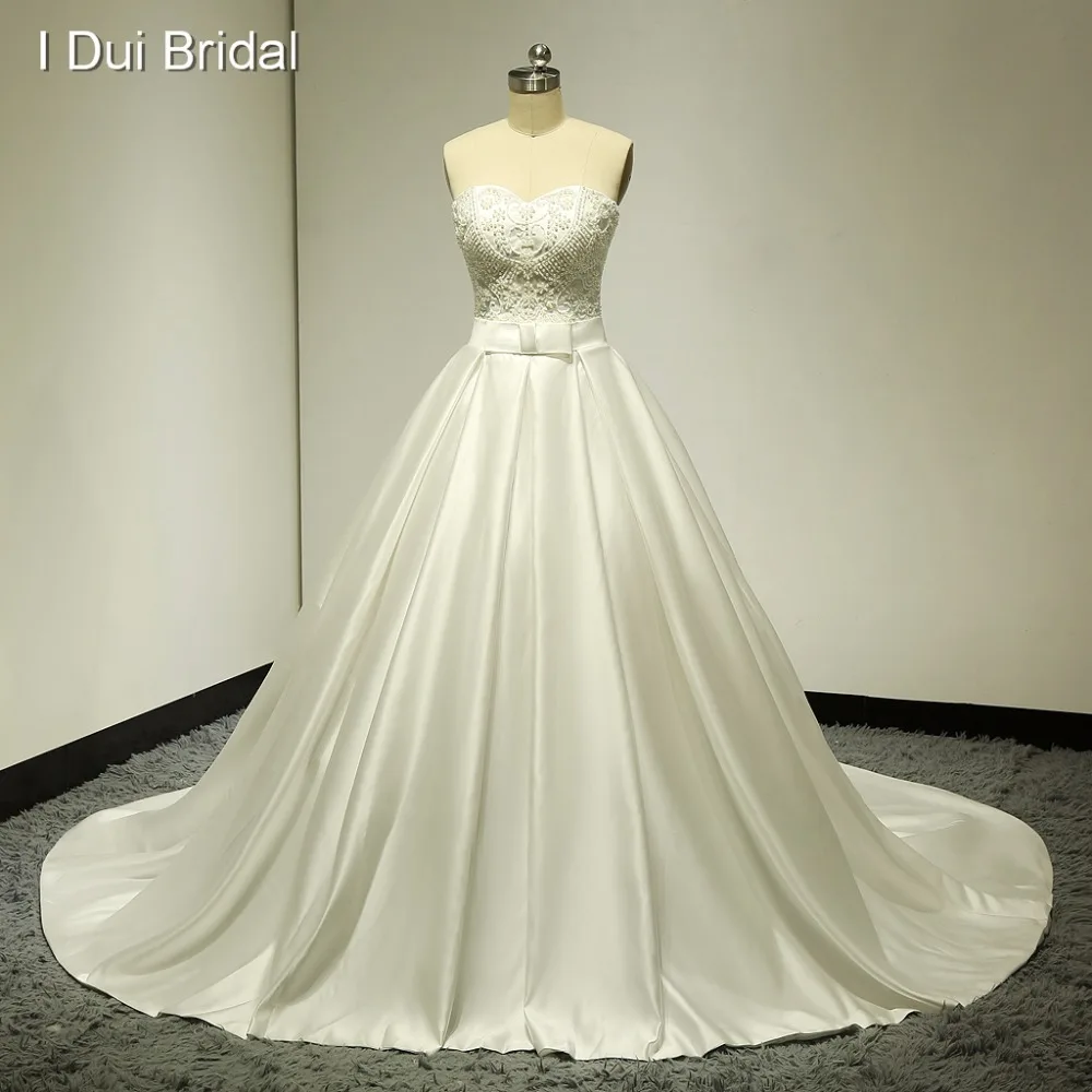 Satin Wedding Dress with Pocket Semi-sweetheart Pearl Beaded Bow Tie Real Photo Factory Custom Made ELS 014
Satin Wedding Dress with Pocket Semi-sweetheart Pearl Beaded Bow Tie Real Photo Factory Custom Made ELS 014