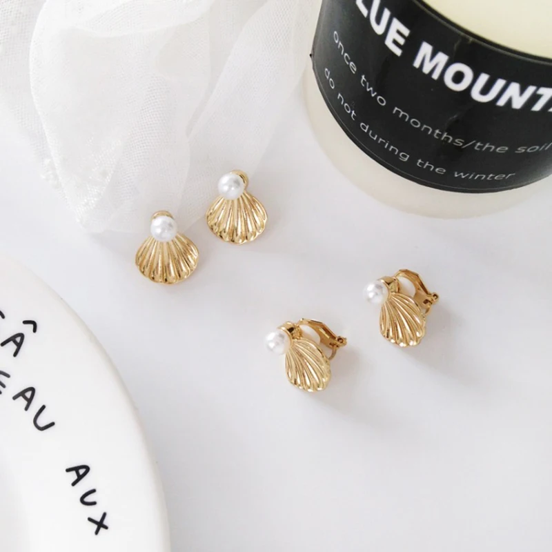 Lady charm shell shape earrings Joker metal pearl earrings No hole ear clip female earrings jewelry accessories wholesale a gift
Lady charm shell shape earrings Joker metal pearl earrings No hole ear clip female earrings jewelry accessories wholesale a gift
