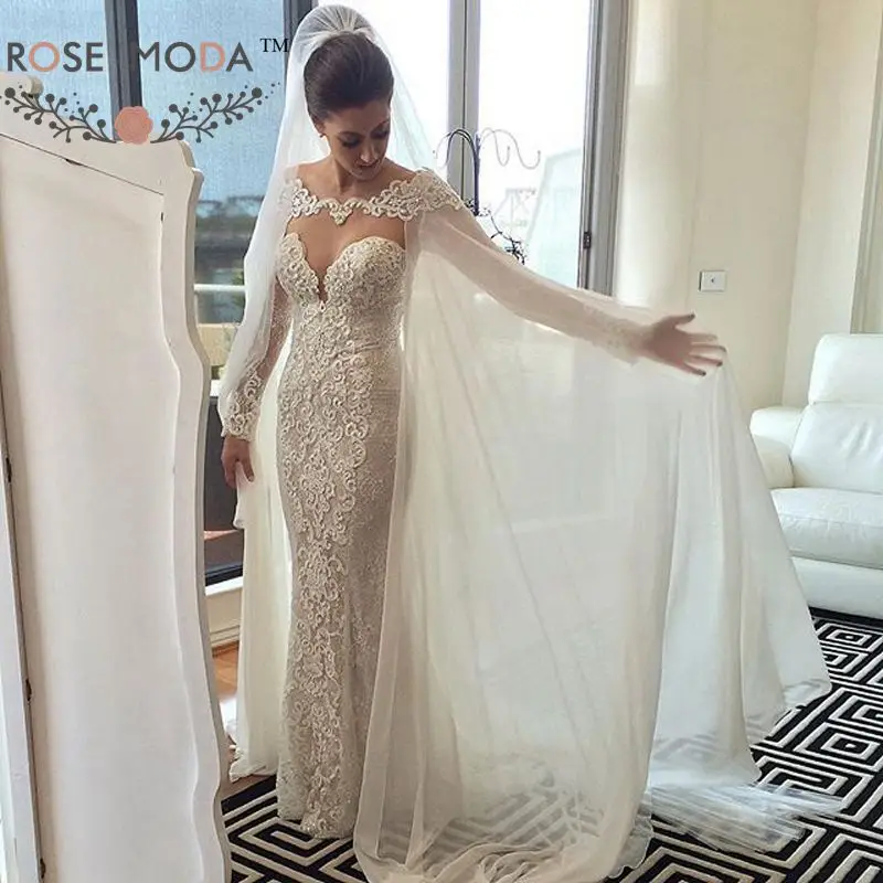 Rose Moda V Neck Long Sleeves Lace Wedding Dress with Removable Cape Backless Lace Bridal Dresses wiith Pearls
Rose Moda V Neck Long Sleeves Lace Wedding Dress with Removable Cape Backless Lace Bridal Dresses wiith Pearls