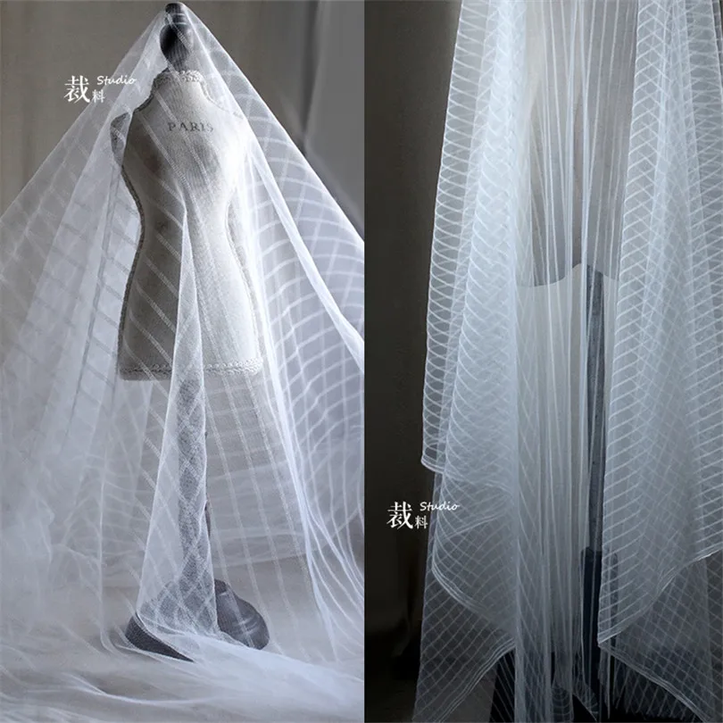 45cm*160cm/piece Stretch black and white striped designer fabric mesh sexy see-through dress creative clothing cloth 
45cm*160cm/piece Stretch black and white striped designer fabric mesh sexy see-through dress creative clothing cloth