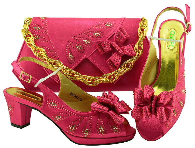 Aso ebi shoes and bag with size 38 to 43 low heel sandal shoes bags in fushia hot pink color italian shoes and bag set SB8286-5
Aso ebi shoes and bag with size 38 to 43 low heel sandal shoes bags in fushia hot pink color italian shoes and bag set SB8286-5
