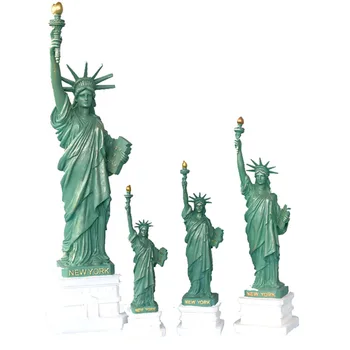 A Statue of liberty sculpture is displayed on living room office book desk as tourist souvenir in New York crafts bookshelf home
A Statue of liberty sculpture is displayed on living room office book desk as tourist souvenir in New York crafts bookshelf home