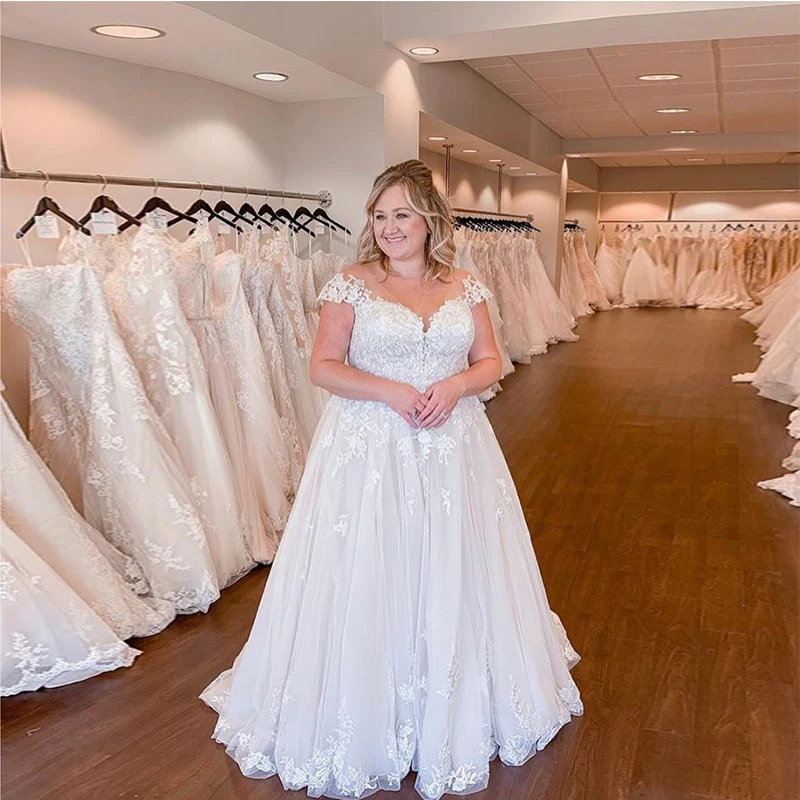 Plus Size Wedding Dresses A-line Cap Sleeves White Ivory Robe De Mariee V-neck Appliques Sweep Train Country Bridal Dress 2019
Plus Size Wedding Dresses A-line Cap Sleeves White Ivory Robe De Mariee V-neck Appliques Sweep Train Country Bridal Dress 2019