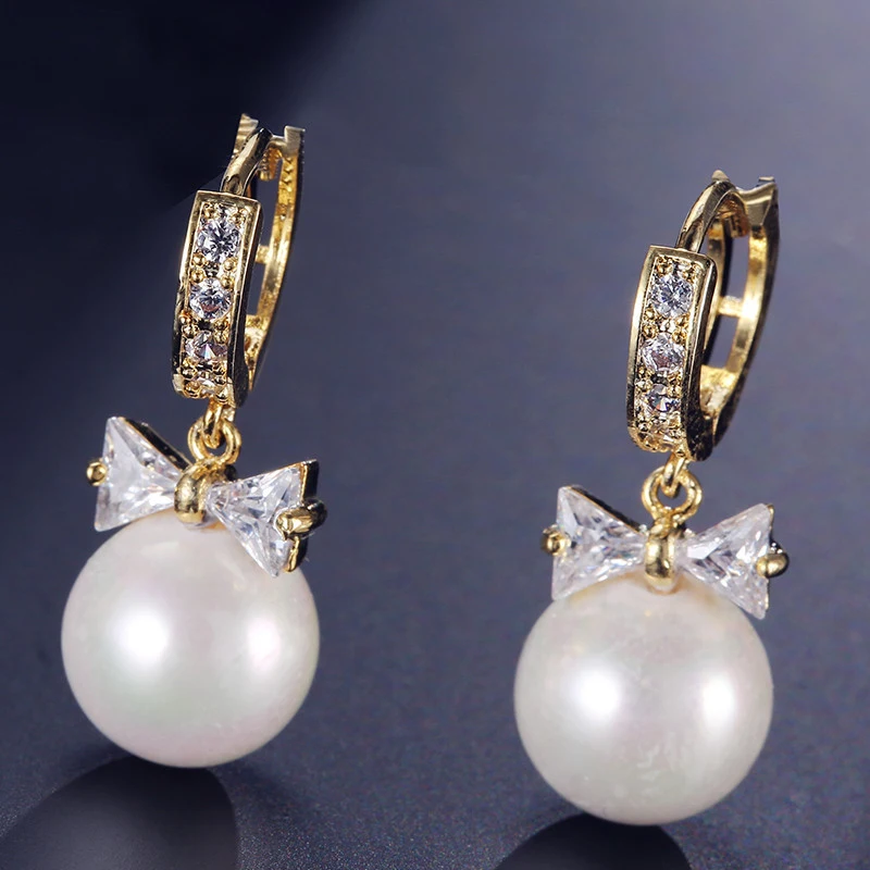 AAA Zircon CZ Pearl Bowknot Drop Earrings Rose Gold Pearl Mother Crystal Earrings Women Clip On Pearl Brinco Wedding Jewelry
AAA Zircon CZ Pearl Bowknot Drop Earrings Rose Gold Pearl Mother Crystal Earrings Women Clip On Pearl Brinco Wedding Jewelry